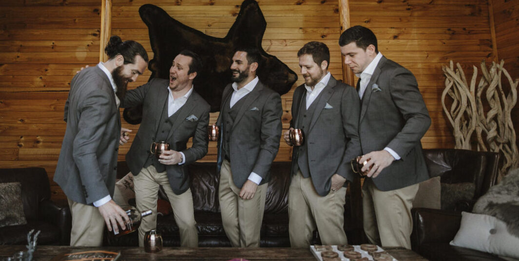 Groom and best men wearing custom made wedding suits posing at sydney wedding